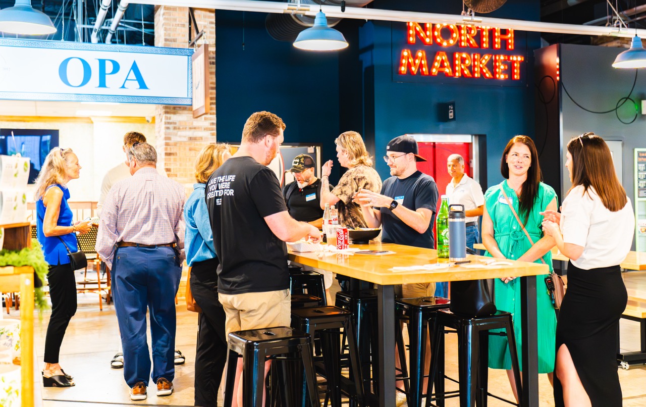 Columbus marketers gathered around a table at North Market during a CMO meetup